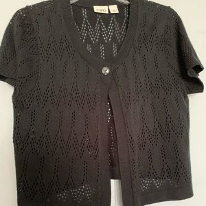 A black  short sleeve button up cardigan.